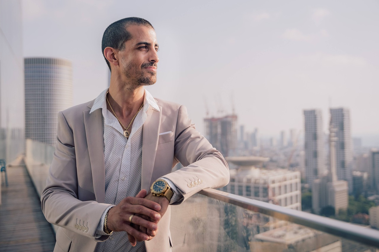 male, model, portrait, man, face, male model, black shirt, smile, smiling, smiling man, modeling, pose, posing, studio photography, male portrait, guy, business, building, office, businessman, thinking, bitcoin, crypto, jewelry